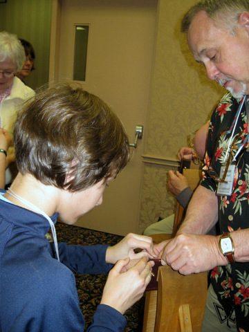 Joanna Malec tries stitching with Paul Kitchener