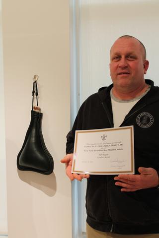 The Irva Ford Award for Best Moulded Article, 2 of 5 — the certificate held up beside the moulded leather bottel it was given for. It reads: “The Canadian Society for Creative Leathercraft presents Leather 2013 – CREATIVE VERSATILITY — Irva Ford Award for Best Moulded Article — to Rob Regan — Leather Bottel — January 12, 2013”.