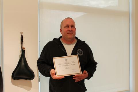 The Irva Ford Award for Best Moulded Article, 4 of 5 — the certificate held up beside the moulded leather bottel it was given for. It reads: “The Canadian Society for Creative Leathercraft presents Leather 2013 – CREATIVE VERSATILITY — Irva Ford Award for Best Moulded Article — to Rob Regan — Leather Bottel — January 12, 2013”.