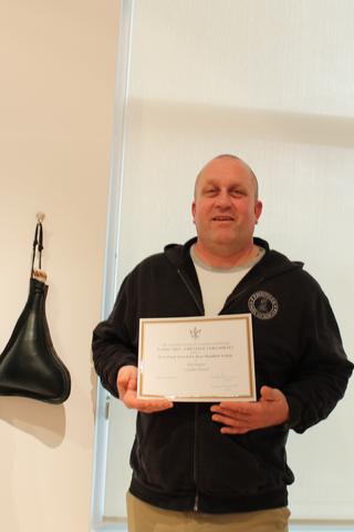 The Irva Ford Award for Best Moulded Article, 5 of 5 — the certificate held up beside the moulded leather bottel it was given for. It reads: “The Canadian Society for Creative Leathercraft presents Leather 2013 – CREATIVE VERSATILITY — Irva Ford Award for Best Moulded Article — to Rob Regan — Leather Bottel — January 12, 2013”.