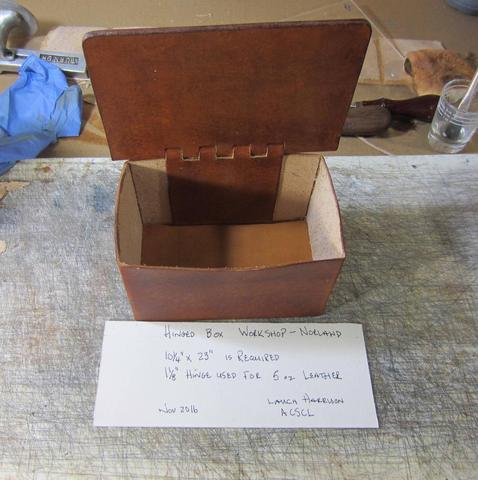 The sample box open, showing the hinge and the inside
