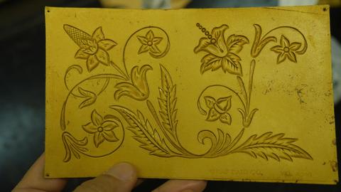 A floral panel, tooled in outline