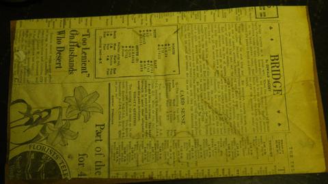 A carving on its newspaper backing