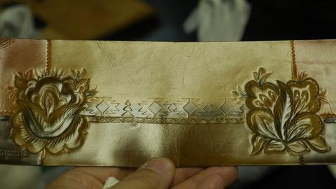 A coloured rose and leaf panel