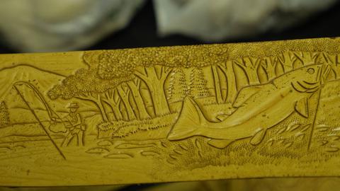 A carved panel with a leaping fish