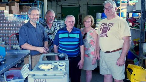 Participants with the casting gear in the warehouse