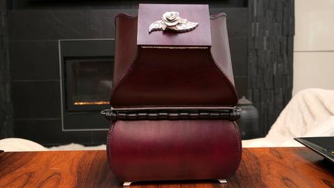 Kim Winchester's Fellowship entry: a burgundy leather case with a pewter rose