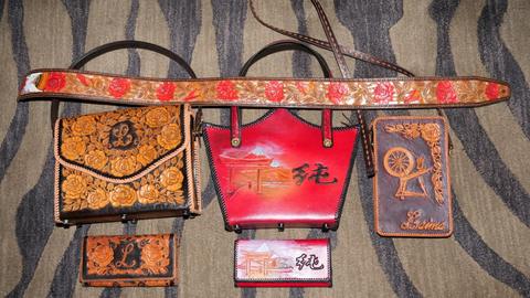 Lester Pinter's entries: carved and painted bags, cases and a belt