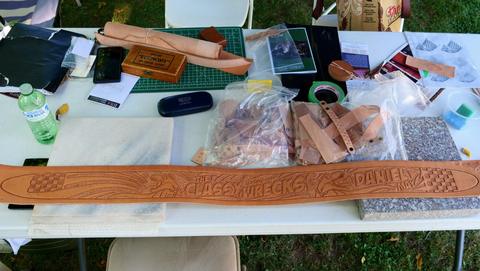 The Society's table: a carved belt, tools and work in progress