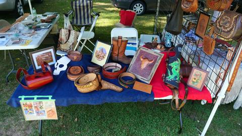 The Society's display: bags, carved pictures, a skull mask and boxes