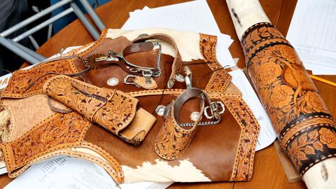 The vest, spurs and straps