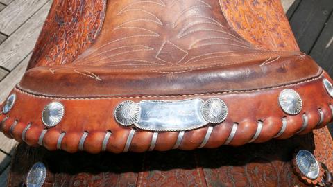 The saddle's cantle, with silver conchos