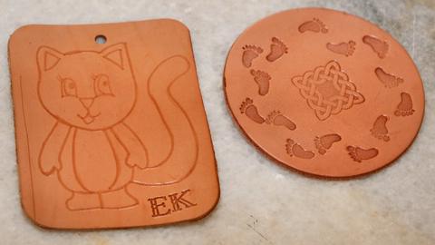 A stamped tag with a cat, and a stamped coaster