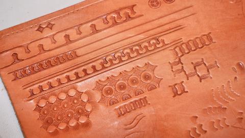 Practice stamping on a strip of leather
