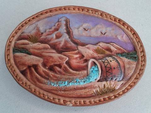 A painted desert-scene belt buckle by Bob Beard, made after his demonstration for the Society, May 2013