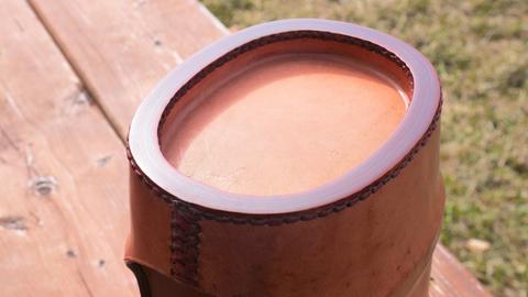 A stitched edge on a moulded leather container, February 2017