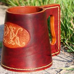 A moulded leather tankard